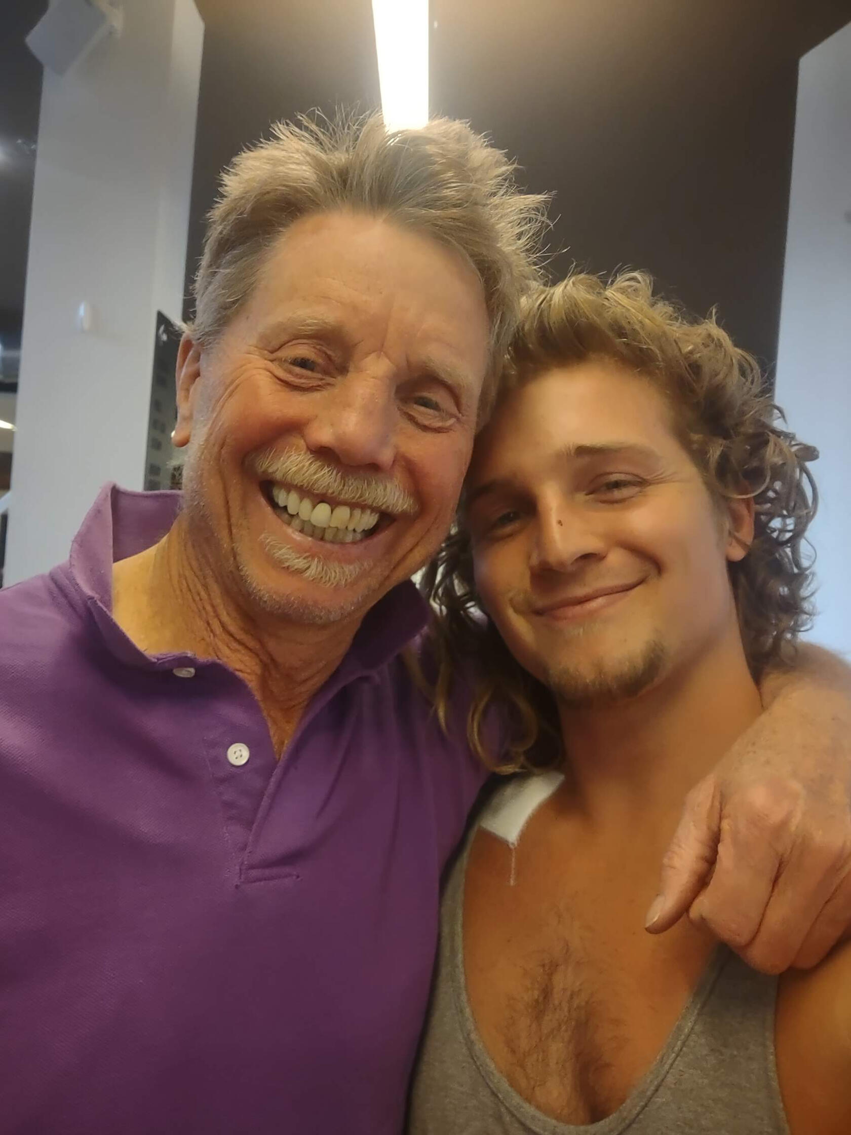 Two men smiling and fit