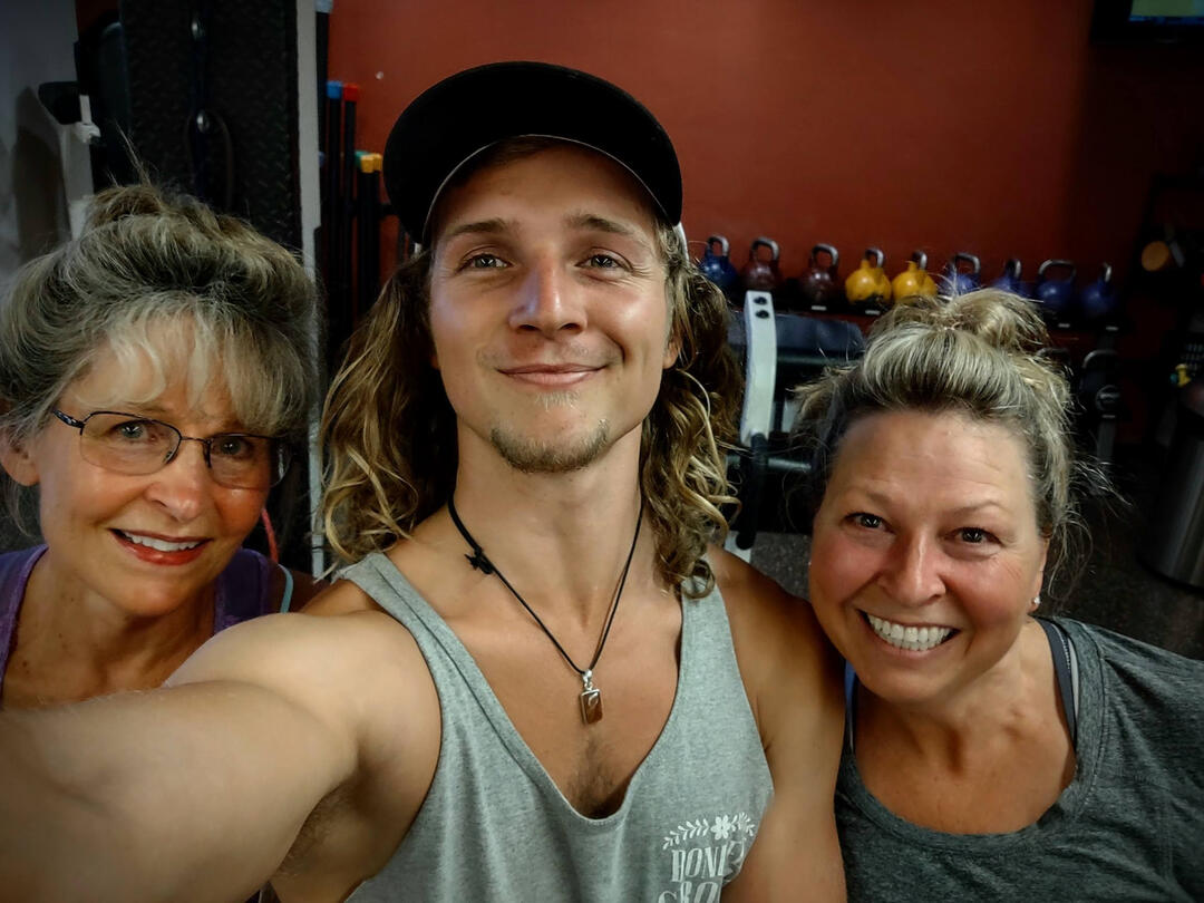 3 people smiling in gym